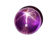 a shiny purple ball on a white background