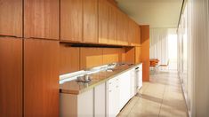 a kitchen with wooden cabinets and white counter tops