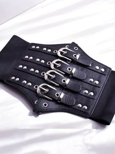 Enhance your edgy and gothic look with this black gothic punk corset belt. Crafted with high-quality materials, this corset belt features a sleek black design with punk-inspired details. Perfect for adding a bold and striking accent to any outfit, this versatile accessory can be paired with a variety of tops and dresses.  Please note that this product includes only the corset belt.  Garment Size   	 		 			Size 			Free Size 		 		 			Width 			12-19 		 		 			Waist 			68-80 Black Punk Corset For Alternative Fashion, Punk Black Corset For Cosplay, Black Edgy Corset For Concert, Black Steampunk Corset Belt For Alternative Fashion, Black Corset Belt For Concert, Black Fitted Corset Belt For Concert, Black Punk Corset Belt, Black Gothic Corset Belt For Alternative Fashion, Black Edgy Corset Belt For Alternative Fashion