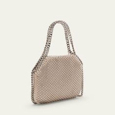 Stella McCartney "Falabella" shoulder bag in allover eco crystal and mesh fabric  Chain top handles with logo disc charm  Chain shoulder strap Can be worn as a top handle or shoulder bag  Open top with magnetic closure  Interior, one card slot  Lining: Satin Approx. 5.9"H x 7.3"W x 2"D Item Weight (Lbs.): 1.0 Made in Italy Silver Chainmail Bag For Everyday Use, Luxury Chain Bag For Events, Top Handle Evening Bag With Chain Strap, Evening Top Handle Shoulder Bag With Chain, Evening Shoulder Bag With Detachable Chain Link Strap, Evening Shoulder Bag With Top Handle And Chain, Evening Shoulder Bag With Chain And Top Handle, Evening Tote Shoulder Bag With Chain Strap, Top Handle Chain Shoulder Bag For Party