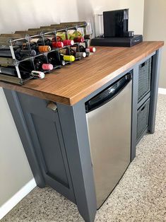 a kitchen island with wine bottles on it