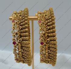 A unique pair of hand accessories to complete your gorgeous look for the festive season and wedding season! Pair this with your stunning saree look or with the most magical Ethnic outfit you have! Openable style. You can go one size up or down. Size: 2.6 Width: Approx. 0.5" Screw Opening Style Single or Pair The antique matt gold plated on high-quality brass as the base metal In-stock & ready-to-ship *Color may vary slightly due to light condition & photography. Jewelry Care: Keep away from mois Luxury Thick Bracelets For Diwali, Luxury Elegant Chandbalis For Eid, Luxury Gold Plated Chandbalis For Diwali, Luxury Chandbalis For Eid Festive, Luxury Chandbalis For Reception, Luxury Gold Sets With Zari Weaving, Luxury Chandbalis For Eid Festive Season, Luxury Gold Chandbalis For Eid, Luxury Fusion Style Chandbalis For Reception