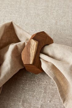 a piece of wood sitting on top of a cloth