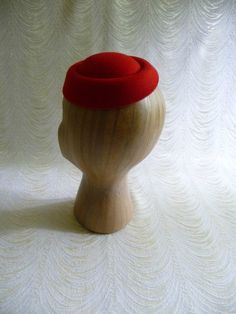 "Molded faux felt pillbox style fascinator hat base in pretty lipstick red that measures 6.5\" x 5.5\" - and has a contoured shape to fit on the head. Low side is approximately .75\" and the higher side is approximately 1.5\". Just attach an alligator clip inside or an elastic to make this a breeze to wear. A cute little base ready for your next DIY millinery project. Easy to decorate with many of the flowers and leaves available in my shop! (PLEASE NOTE this is a FASCINATOR SIZE HAT BASE not a Fitted Formal Flat Cap Felt Hat, Elegant Fitted Red Felt Hat, Classic Red Felt Hat For Formal Occasions, Red Fitted Felt Hat For Formal Occasions, Classic Red Formal Felt Hat, Red Fitted Vintage Top Hat, Formal Red Fitted Felt Hat, Red Fitted Top Hat For Winter, Classic Red Fitted Top Hat