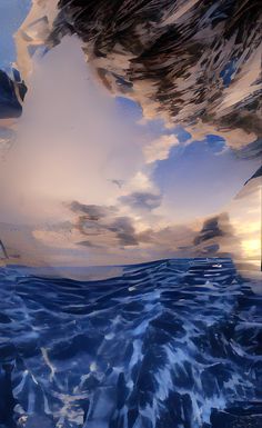 an image of the ocean with clouds reflected in it's water and blue waves