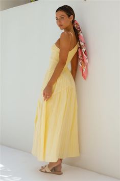 The Beaming Hues One Shoulder Maxi Dress in Yellow exudes a sunlit radiance that perfectly complements the golden sands and azure waters of your dreamy holiday destination. Draped in this vibrant dress. you effortlessly blend with the enchanting surroundings. Maxi dress. true to size One shoulder design with tie detail Stretchy ruched bust Softly pleated skirt Semi-lined 100% Polyester. Lining: Rayon Non-stretch material Please refer to the care label on your garment for specific instructions on how to care for it Model wears XS Length from shoulder to hem: 130cm on an S Chest 35cm. Waist 28cm. size S Plunge Neck Maxi Dress, Bandeau Maxi Dress, One Shoulder Maxi Dress, Vibrant Dress, Mini Dress Formal, Strapless Maxi, Strapless Maxi Dress, Dress Yellow, Satin Slip