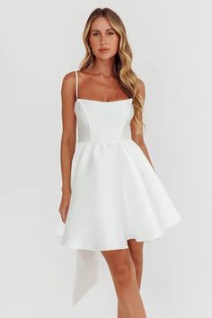 Shop the Athens Flared Bow Mini Dress White | Selfie Leslie Mini Dress With Back Zipper For Wedding, Solid Mini Dress For Wedding, Solid Color Mini Dress For Wedding, Summer Prom Mini Dress With Corset Back, Chic Solid Mini Dress For Prom, Summer Wedding Mini Dress With Spaghetti Straps, White Mini Length Suspender Dress For Night Out, Chic A-line Suspender Dress For Cocktail, White Mini Dress With Sweetheart Neckline And Back Zipper