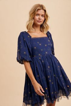 This cosmic charmer is all about the darling details! This dreamy celestial midnight sky dress is giving magic! Featuring a dainty starry night sky print, a square neckline and a flirty mini hem length. Crafted with a layer of tulle and mesh to give fairytale volume, creating ethereal movement with every step. Get ready for the compliments!  Whimsical celestial print  Square neckline Smocked back Tulle and mesh layered underskirt  Fully lined  Hidden side zipper closure  Minimal stretch through bust  Self poly, liner rayon  3/4th sleeves  True to size  Size Guide: SMALL: WOMEN'S 2/4 MEDIUM: WOMEN'S 4/6 LARGE: WOMEN'S 8/10 Item Measurements:   S: Bust 36"  M: Bust 38"  L: Bust 40" Night Sky Costume, Whimsical Celestial, Dress Coquette, Coquette Dress, Starry Night Dress, Celestial Dress, Sky Dress, Celestial Print, Moon Dress