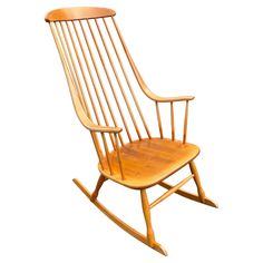 a wooden rocking chair on a white background