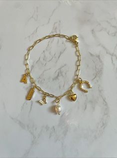 THIS IS A PRE-ORDER ITEM! Because this bracelet is custom-made, the processing time is 2 to 4 weeks before shipment. This is in addition to your selected shipment time at checkout. —————— ‣ 14k gold plated paper clip chain + gold filled charms ‣ You MUST choose the charms other you want! The bracelet does not automatically come with any charms! Charm Necklace Diy, Jewelry Accessories Ideas, Gold Charm Bracelet, Jewelry Essentials, Stacked Jewelry, Jewelry Lookbook, Business Idea, Chain Gold, Girly Jewelry