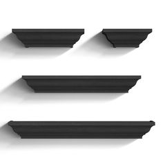 four black shelfs are arranged on the wall