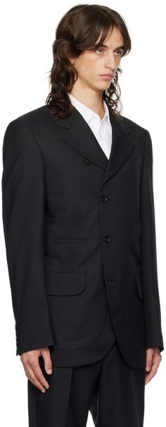 Wool-blend dobby cloth blazer. · Notched lapel · Button closure · Welt pocket and flap pockets · Padded shoulders · Four-button surgeon's cuffs · Twin vents at back hem · Welt pockets at interior · Full cupra satin lining Supplier color: Black Formal Suits With Button Closure, Formal Button-up Suits With Hidden Closure, Formal Suits With Hidden Button Closure, Business Suits With Button Closure And Lapel Collar, Formal Double Button-up Suits, Semi-formal Blazer With Button Closure, Business Blazer With Lapel Collar And Buttons, Blazer With Hidden Button Closure For Business Meetings, Tailored Button-up Sport Coat For Formal Occasions