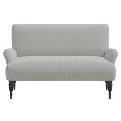 a gray couch sitting on top of a white floor