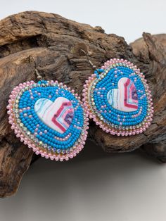 Beautifully hand beaded, turquoise colored, heart shaped, 2-inch-wide earrings with hypoallergenic hooks. Genuine leather backing.  These come gift-ready in carboard Kraft jewelry box with descriptive card as shown. These earrings were Beaded for Creator's Place by a Pine Point tribal artisan of the White Earth Nation in Northern Minnesota. Handmade Heart-shaped Jewelry For Festivals, Handmade Artisan Heart Earrings, Multicolor Beaded Jewelry For Valentine's Day, Traditional Heart-shaped Jewelry With Heart Beads, Bohemian Beaded Jewelry For Valentine's Day, Valentine's Day Multicolor Beaded Jewelry, Valentine's Day Bohemian Beaded Jewelry, Multicolor Heart Beads Earrings For Gift, Bohemian Beaded Earrings With Heart Beads For Gift