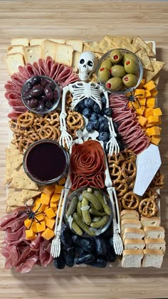 a skeleton made out of food on a wooden table