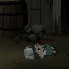 a cartoon character laying on the ground next to a barrel