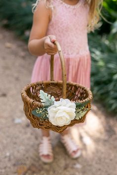 "/ MEET BRISTOL ---------------------- A handmade wicker flower girl basket in natural, peeled willow. Bristol features lush artificial greenery and is accented with a handmade chiffon fabric flower. Inspired by rustic weddings, she's perfect for flower girls of all ages. / ADDITIONAL DETAILS ---------------------- * Basket dimensions: 9\"L x 7\"W x 4.5\"H (10\"H w/ handle) * Sturdy, woven peeled willow basket * Single, fixed handle for easy carrying / THERE'S MORE FOR YOU! --------------------- Willow Wedding, Flower Girl Basket Rustic, Willow Flower, Basket Willow, Greenery Wedding Decor, Willow Basket, Basket Small, Ivory Flower Girl, Flower Girl Baskets