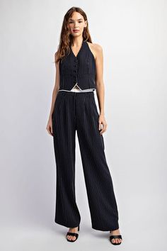 Expertly tailored for a classic and polished look, our Navy White Pinstriped Tailored Contrast Trousers feature a pinstriped woven fabric that adds a touch of sophistication. The contrast elastic waist provides comfort and style, making these trousers perfect for any occasion. Fabric & fit: 90% POLYESTER 10% VISCOSE Model is wearing size Small. Summer Workwear Bottoms With Striped Hem, Chic Pinstripe Bottoms For Workwear, Chic Vertical Stripes Bottoms For Business Casual, Chic Vertical Striped Bottoms For Business Casual, Chic Pinstripe Bottoms For Business Casual, Chic Bottoms With Vertical Stripes For Business Casual, Elegant Pinstripe Bottoms For Summer, Chic Pinstripe Pants For Summer, Chic Pinstripe Summer Pants