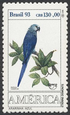 a stamp with a blue bird sitting on top of a leafy branch and the words america written below it