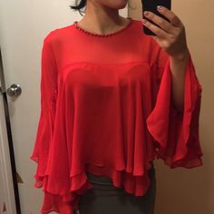 Nwt. In Perfect New Condition. True Red Color. True To Size Xs. Neckline Is Embellished. Poncho Style Blouse Top. Soft And Comfortable. 22” Long. No Trades. Chic Red Party Blouse, Elegant Red Evening Top, Elegant Red Tops For Evening, Elegant Red Top For Evening, Chic Red Blouse For Evening, Glamorous Red Blouse, Elegant Red Party Tops, Red Evening Blouse For Spring, Elegant Red Blouse For Night Out