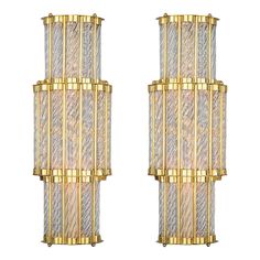 two wall lights with glass panels and gold trim