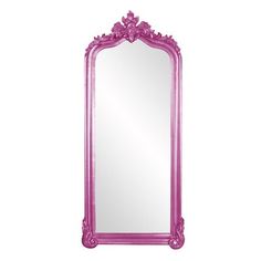 a large pink mirror sitting on top of a white wall