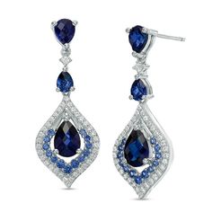 Frame her face with the dazzling look of these fashion drop earrings. Crafted in sterling silver, each earring features a 7.0 x 5.0mm pear-shaped lab-created bright blue sapphire in a flame-shaped double frame of lab-created white and blue sapphires. Two additional pear-shaped blue sapphires decorate the earring bridge and post, assuring a spectacular presentation. Buffed to a brilliant luster, these earrings secure comfortably with friction backs. Elegant Blue Pear-shaped Diamond Earrings, White Gold Teardrop Chandelier Earrings Fine Jewelry, White Gold Teardrop Chandelier Earrings, Teardrop Pendant Earrings In Cubic Zirconia, Blue Teardrop Diamond Earrings For Anniversary, Elegant Gemstone Teardrop Chandelier Earrings, White Gold Teardrop Earrings For Evening, Formal Blue Pear-shaped Diamond Earrings, Teardrop Earrings With Elegant Design