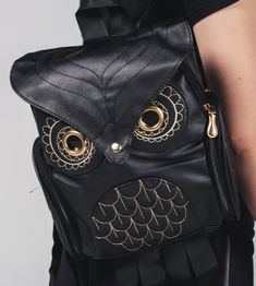 "Get ready to elevate your style with this stunning Owl mini backpack. Made from high-quality black leather, this backpack measures 12 X 9 inches by 4 inches, making it the perfect size for all your essentials. Add a touch of elegance to your wardrobe with this must-have fashion accessory!" Black Faux Leather Backpack For On-the-go, Black Faux Leather Trendy Backpack, Trendy Black Faux Leather Backpack, Black Faux Leather Backpack For School, Trendy Backpack With Leather Backing, Black Faux Leather Satchel Backpack, Black Faux Leather School Backpack, Trendy School Backpack With Leather Backing, Black Faux Leather Backpack With Adjustable Strap