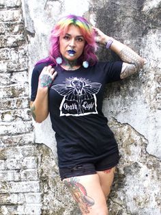 Invoke your inner Goth, but keep it light.  Soft cotton Pre-shrunk Unisex Logo designed by New Orleans artist Jeff Louviere and printed by Inferno Printing in Louisiana Models wear size Small, for a more fitted look size down. Like it a little roomier, size up. Fitted Grunge Skull Print T-shirt, Fitted Grunge T-shirt With Skull Print, Stretch Crew Neck T-shirt For Alternative Fashion, Alternative Stretch T-shirt For Streetwear, Fitted Alternative Style T-shirt, Stretch Punk T-shirt For Alternative Fashion, Alternative Fitted T-shirt With Skull Print, Fitted Skull Print T-shirt Band Merch, Punk Style Stretch Cotton T-shirt