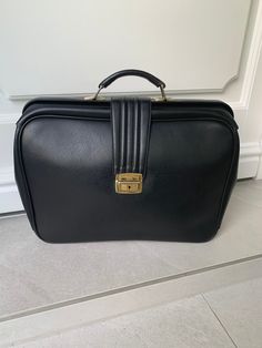 A very elegant and neat black briefcase from the 70s. Very chic and trendy W=45 cm H=33 cm D=10 cm You can count on careful packaging and proper delivery! Vintage Rectangular Briefcase For Business, Vintage Business Briefcase Rectangular Case, Vintage Rectangular Business Briefcase, Vintage Rectangular Business Case, Vintage Rectangular Briefcase For Work, Vintage Rectangular Briefcase For Business Trips, Vintage Rectangular Laptop Bag For Formal Use, Vintage Rectangular Briefcase For Formal Use, Vintage Rectangular Briefcase For Formal Occasions