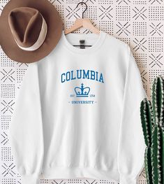 Columbia University Sweatshirt, Columbia University Est 1754 College Student, University Sweatshirt, Custom University College Sweatshirt WELCOME TO "StyleDesignUS" High quality and super soft, comfortable Sweatshirt and Hoodies. Made with top of the line vinyl and pressed with a professional grade heat press. SIZING AND COLORS Make sure you check our size-chart before you place your order. If you are not sure about sizing please measure your favorite Sweatshirt or Hoodie and compare measurement Crew Neck T-shirt With University Logo For Fall, Long Sleeve Cotton T-shirt With University Logo, University Logo Crew Neck Top For Fans, University Logo Crew Neck Top Fan Apparel, Collegiate White Sweatshirt For College, University Logo Crew Neck Top, White Crew Neck Sweater For College, University Logo Crew Neck T-shirt For Fall, Collegiate White Sweatshirt With Text Print