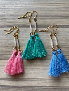 "I feel like these are so perfect for summer! Cute little tassels hanging from a beaded bar. Approximately 2\" long." Bohemian Tassel Earrings With Fringe For Spring, Beaded Drop Earrings With Tassels For The Beach, Beaded Tassel Drop Earrings For Beach, Blue Beaded Fringe Tassel Earrings For Summer, Summer Blue Beaded Earrings With Tassels, Blue Tassel Earrings With Dangling Beads For Summer, Pink Tassel Beaded Earrings For Beach, Bohemian Fringe Earrings For Spring, Spring Bohemian Beaded Dangling Earrings