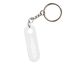 a white keychain with a metal hook on it