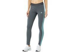 adidas 3-Stripes Leggings - Women's Clothing : Dark Grey Heather/Mint Ton : The comfortable tight fitting silhouette of the adidas 3-Stripes Leggings feature an elasticized waistline, ankle cut, and hip trefoil logo. adidas partners with Better Cotton Initiative (BCI) to improve cotton farming globally. 93% cotton, 7% spandex. Machine wash warm, tumble dry low. Imported. Measurements: Waist Measurement: 26 in Outseam: 35 in Inseam: 28 in Front Rise: 9 1 2 in Back Rise: 12 1 2 in Leg Opening: 10 Striped Athleisure Activewear For Sports, Sportswear Cotton Activewear With Three Stripes Branding, Spring Adidas Cotton Activewear, Cotton Sportswear With Three Stripes Branding, Adidas Activewear With Side Stripes For Gym, Adidas Cotton Activewear, Adidas Cotton Sporty Activewear, Sporty Fitted Cotton Leggings, Adidas Activewear With Athletic Fit And Three Stripes Branding