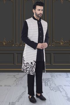 Introducing our R14-S76 Sherwani, a modern and elegant addition to your wardrobe. The unique floral design on the open jacket sherwani exudes sophistication and style. Elevate your look and make a statement with this premium piece. Designer Nehru Jacket For Eid Reception, Designer Nehru Jacket With Resham Embroidery, Elegant Long Sleeve Nehru Jacket For Designer Wear, Designer Unstitched Bandhgala For Designer Wear, Designer Bandhgala For Winter Reception, Designer Winter Bandhgala For Reception, Designer Semi-formal Kurta With Resham Embroidery, Elegant Formal Outerwear With Chikankari Embroidery, Semi-formal Fitted Nehru Jacket With Chikankari Embroidery