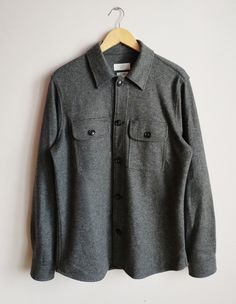 This stylish men's shirt has a slim fit with a tailored silhouette is highly comfortable. Classic Collar Fastening: Button Pockets: Chest pockets Color:Grey Condition: Like New Fabric material: 47% polyester,20% wool,13%cotton, 16 % nylon, 4%viscose Size tag:L *Please check the measurements below to make sure they fit correctly! Total length: 74cm /29.13inch Width (armpit to armpit) : 45cm/17.71inch Arm's length: 67cm / 26.37 inch Shoulders:44 cm/17.32inch ✈Shipping: All items will be shipped vi Slim Fit Shirt With Pockets For Fall, Winter Shirt With Button Closure And Casual Collar, Gray Long Sleeve Shirt With Button Closure, Slim Fit Button-up Winter Top, Slim Fit Winter Button-up Top, Winter Button-up Slim Fit Tops, Winter Shirt With Button Closure And Lapel Collar, Gray Shirt With Button Closure For Fall, Winter Workwear Shirt With Snap Buttons