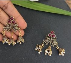 "This Unique pair of Earrings is designed and crafted at PraNiCollectioNs  PraNiCollectioNs is the place for anyone who Is in lookout for a latest trend with an ethnic touch.  We at PraNiCollectioNs offers a great range of Indian Ethnic jewellery's. We are strongly committed to  providing our customers  some uniquely handcrafted products with utmost satisfaction. These jewellery's are made from high quality  material which are Hypoallergenic and are also free from corrosion and rusting This list Festive Brass Jhumkas, Brass Temple Jewelry Earrings For Rituals, Festive Brass Latkans Earrings, Traditional Brass Earrings For Navratri, Gold Bohemian Earrings For Navratri, Diwali Brass Earrings With Tilla, Temple Jewelry Festival Earrings With Latkans, Festival Brass Drop Jhumkas, Oxidized Brass Jhumkas