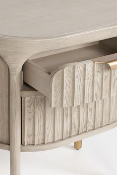 a close up of a wooden table with drawers on the top and bottom part of it