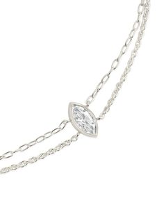 This dainty layered bracelet is the perfect way to add some shine to your look! The CZ center stone is sure to be the perfect finishing touch to any outfit. Available in gold and silver tones. Materials: 14K gold or rhodium plated brass, cubic zirconia Features: Measures 7" with 1" extender, 0.45" bezel CZ stone, 10mm CZ stone, 1mm chain, Lead & Nickel free, lobster clasp Elegant Adjustable Sterling Silver Bracelet, Silver Dainty Double Chain Jewelry, Silver Dainty Jewelry With Double Chain, Dainty Silver Jewelry With Double Chain, Formal Sterling Silver Bracelets With Delicate Chain, Formal Sterling Silver Bracelet With Delicate Chain, Elegant Silver Delicate Chain Bracelet, Sterling Silver Double Strand Chain Jewelry, Elegant Double Chain Adjustable Bracelet