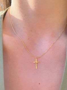 This minimalistic Cross Necklace features a small gold cross with a high polish finish that sits on a delicate 14K Yellow Gold chain. It's perfect for layering with your favorites or styled solo for a classic look. Necklace Length: 16 Inches *with a 2-inch extension Pendant Length: 1.5 cm Pendant Width: 1 cm Chain Type: Flat Cable Clasp: Lobster Metal: 14K Yellow Gold (stamped) Dainty 14k Yellow Gold Cross Necklace, Minimalist Tarnish Resistant Yellow Gold Cross Necklace, Minimalist Tarnish-resistant Yellow Gold Cross Necklace, Dainty Yellow Gold Cross Necklace For Everyday, Simple Yellow Gold Cross Necklace, Yellow Gold Cross Necklace With Delicate Chain, 14k Gold Cross Necklace With Delicate Chain, 14k Gold Delicate Chain Cross Necklace, Dainty Yellow Gold Crucifix Cross Necklace