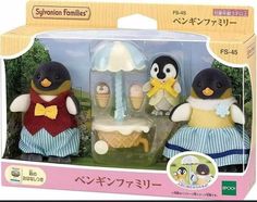 two penguins are standing next to each other in front of a box with an ice cream parlor