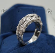 a wedding ring with an intricate design on it