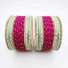 Beautifully designed bangles for any occasion. South asian bracelets come in a variety of styles, colors, and finishes. We at Banglez take creating the perfect bangle set for you to another level! You could say helping you find your favorite stack of bangles as one of our greatest missions. This bangle set was curated in house by one of our talented team members. We hope you love them as much as we do! Pink Bangle Jewelry For Festival, Traditional Pink Bangle For Gift, Traditional Pink Bangle As Gift, Traditional Adjustable Blue Bangle, Festive Stackable Bangle Bracelets, Handmade Adjustable Pink Bangle, Traditional Adjustable Pink Bangle, Stackable Festival Bangles, Adjustable Handmade Pink Bangle