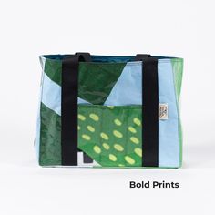 Perfectly sized for travel with interior & exterior pockets. The design on each bag varies, as they are crafted from upcycled billboards, ensuring a one-of-a-kind piece with every purchase. Colorful fabric lined interior Magnetic snap enclosure Interior & exterior pockets Handmade using material from Organic Valley billboards One-of-a-kind Available in two sizes: Large: 17”x6"x12” Small: 13”x7"x10” This latest edition to the PROTECT Collection, is lovingly handmade by the artisans at the 55saint Modern Rectangular Recyclable Bag, Rectangular Upcycled Canvas Bag, Upcycled Rectangular Canvas Bag, Modern Green Bags With Pockets, Everyday Green Bags Made Of Recycled Materials, Reusable Rectangular Bags Made Of Recycled Materials, Green Casual Upcycled Bags, Casual Green Upcycled Bags, Blue Everyday Bag Made Of Recycled Materials