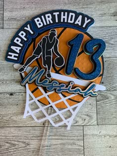 a happy birthday sign with a basketball on it's back and the number 13