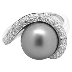 Material: 14K white gold Pearl: 1 11.25MM Tahitian pearl Diamonds: 53 round cut = .53cttw Color: H Clarity: SI1 Ring Size: 7 (please allow two additional shipping days for sizing requests) Dimensions: ring measures 15.5mm wide Weight: 12.03 grams Pearl And Diamond Ring, Modern Ring, Tahitian Pearls, Pearl Diamond, Gold Pearl, Tahiti, Ring Size 7, Modern Jewelry, Pearl White