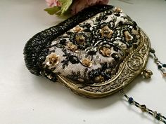 "This Victorian style reticule small evening purse will be a great accessory to your cocktail party dress, gala, formal event, living history festivals, Halloween flapper costume, and more! It will add a luxurious look to any evening look. The neutral colors allow you to match with various outfits. The black lace is over a champagne beige color underneath. The floral beading and details with rhinestones add a timeless elegant look. The kisslock closure top is made of metal designed to look like Handmade Black Evening Bag For Wedding, Elegant Clutch Evening Bag For Vintage Events, Victorian Handmade Evening Bag For Formal Occasions, Elegant Handmade Evening Bag For Vintage Events, Handmade Victorian Evening Bag, Victorian Rectangular Party Bag, Vintage Handmade Evening Bag For Party, Elegant Handmade Evening Bag, Vintage Handmade Evening Bag