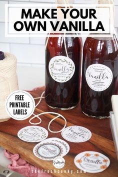 two jars filled with jam sitting on top of a wooden table next to twine spool