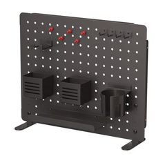 a black wall mounted rack with three red knobs and two white dots on it