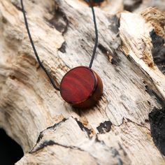 "Prices stated are total prices. Sales tax is not shown due to small business status in accordance with Section 19 UStG." A charming pendant that I made from two beautiful pieces of wood. I used these woods because they complement each other well and create a great contrast. The wood is natural and not stained, has been painstakingly sanded and polished by hand. This is the perfect piece of jewelry for all nature lovers. The pendant has a diameter of 24.5 mm. The necklace with pendant is deliver Minimalist Jewelry In Natural Tones As A Gift, Handmade Wooden Pendant Jewelry, Gift Wooden Bead Necklaces In Natural Wood, Artisan Wooden Jewelry As A Gift, Natural Wood Necklaces With Wooden Beads For Gift, Artisan Wood Jewelry Gift, Handmade Wooden Necklace Gift, Handmade Natural Wood Pendant Jewelry, Artisan Natural Wood Necklace As A Gift